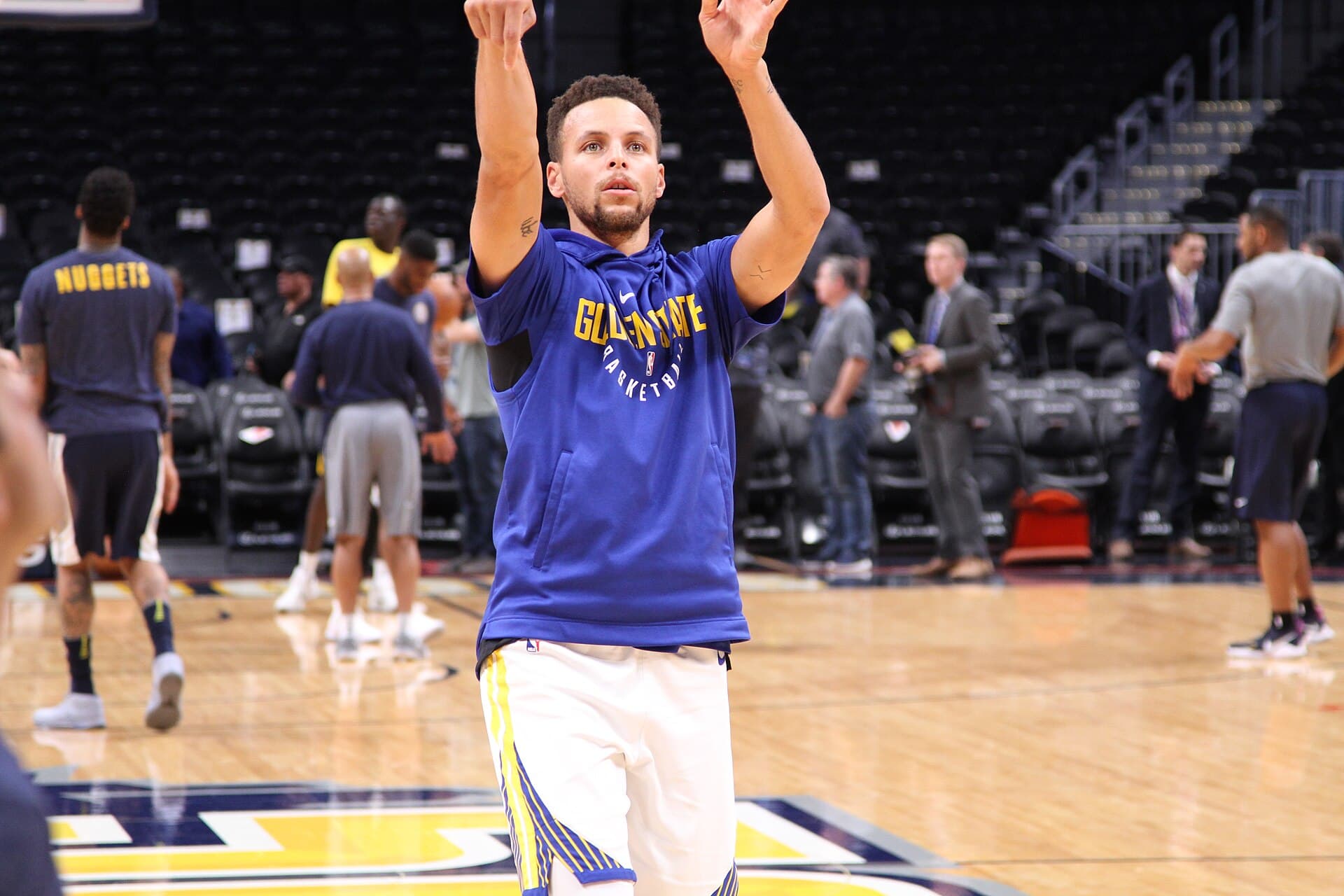 Stephen Curry raising his hands during a Golden State Warriors practice session